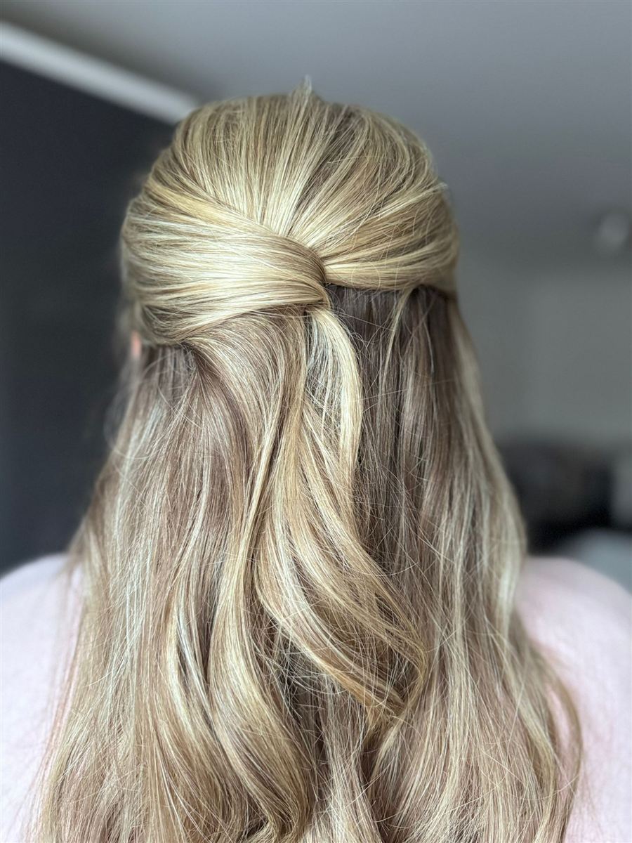 Soft half-up twist with flowing blonde waves